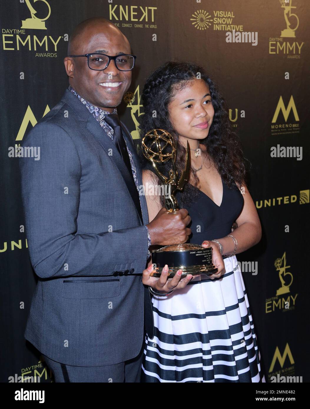 Wayne Brady, left, and daughter Maile Masako Brady pose in the press(01)