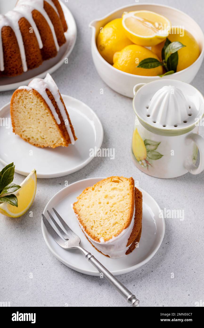 Lemon bundt cake drizzled with powdered sugar glaze Stock Photo Alamy