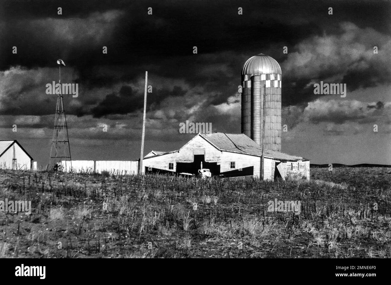 Severe weather with a barn adapted as an airplane aviation hangar at a rural farm on the Northern Great Plains of the United States Stock Photo