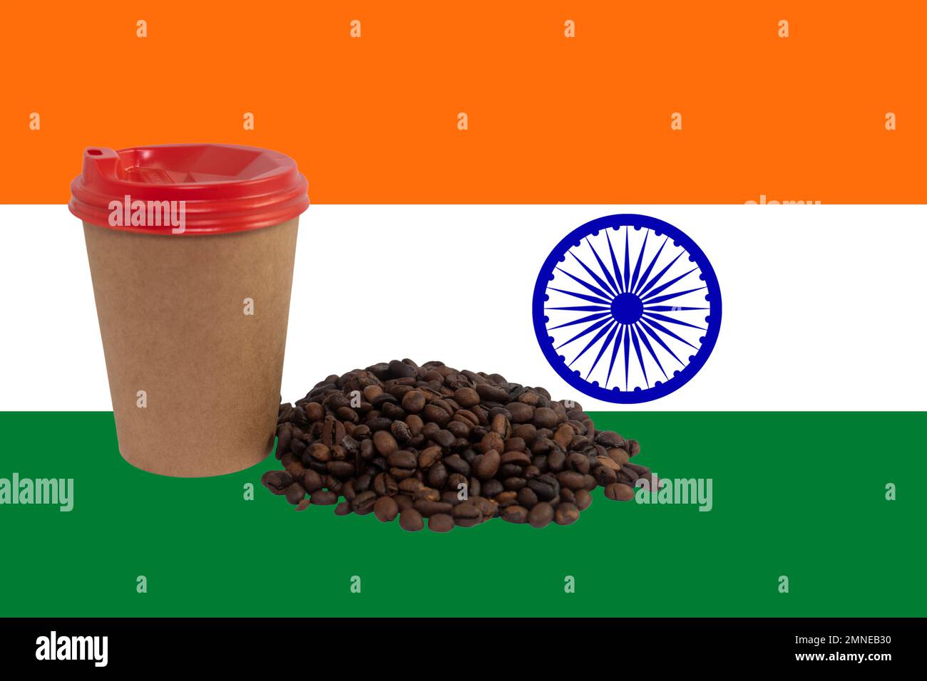 Cup and a handful of roasted coffee beans against the background of the