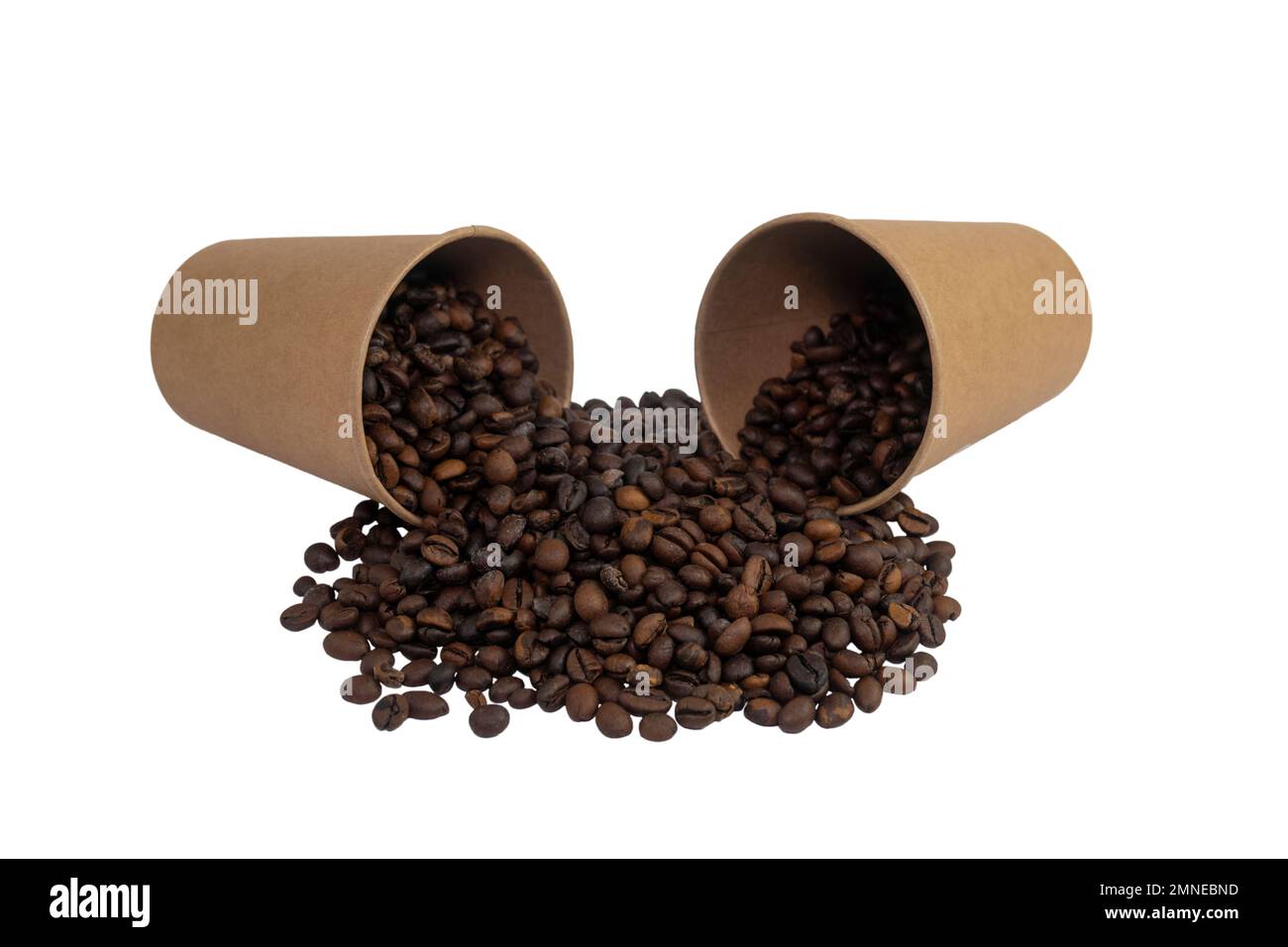Two overturned disposable paper cups filled with roasted coffee beans ...