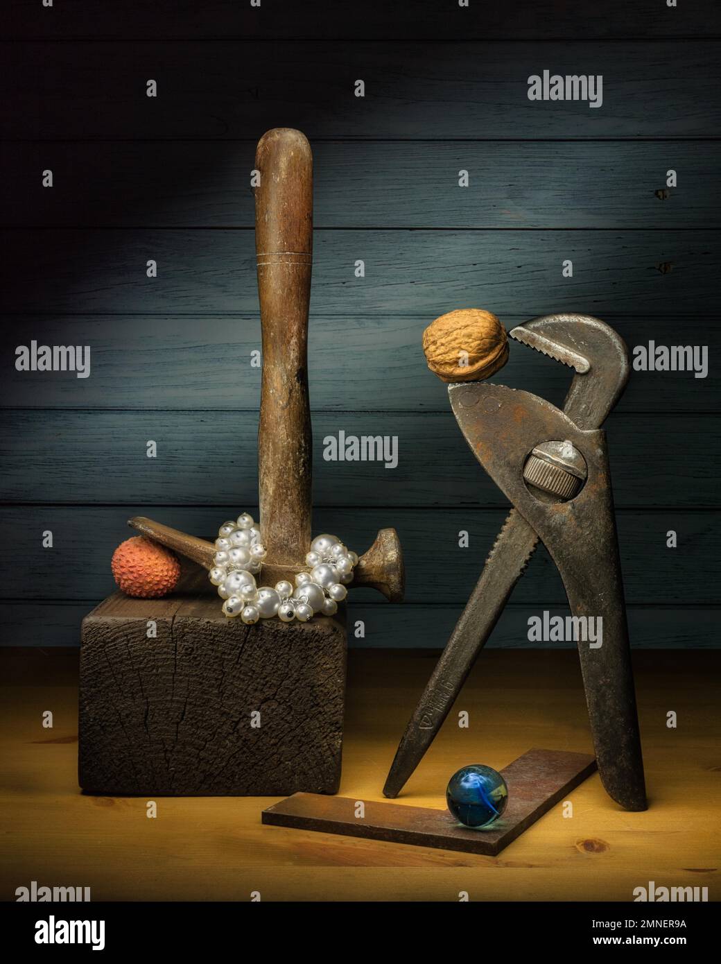 Still life with rolling fork spanner, cobbler's hammer, metal angle