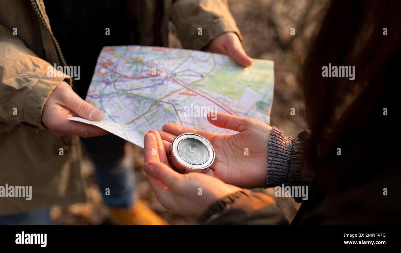 close up travelers with map compass. Beautiful photo Stock Photo