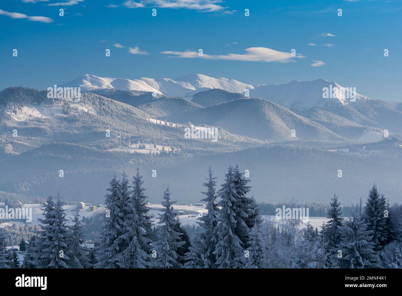 Snow covered Carpathian mountains in winter. Tihuta Pass Piatra Fantanele Romania Stock Photo