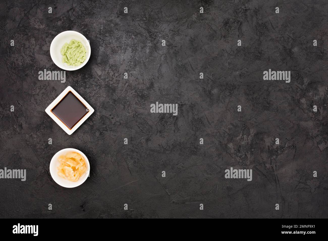 marinated ginger soy sauce wasabi bowl arranged row textured black