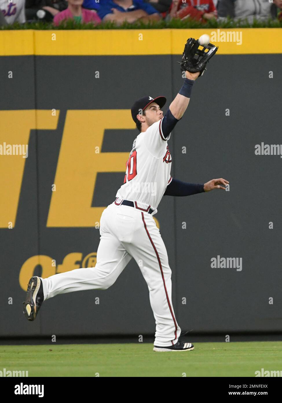 Atlanta Braves left fielder Preston Tucker catches a fly ball hit by