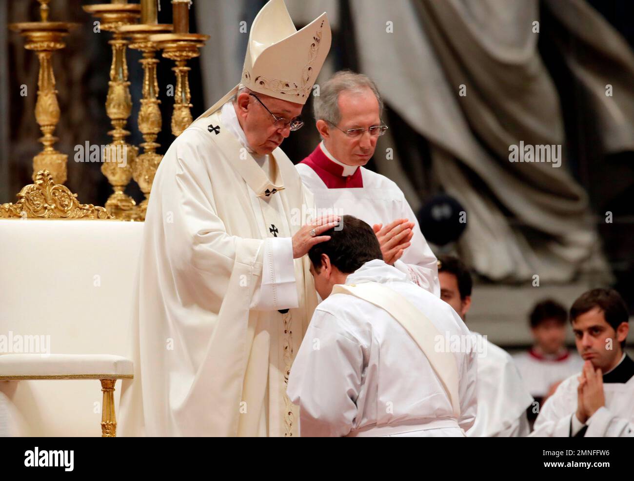 Peope Francis blesses a new priest during an ordination ceremony in St ...