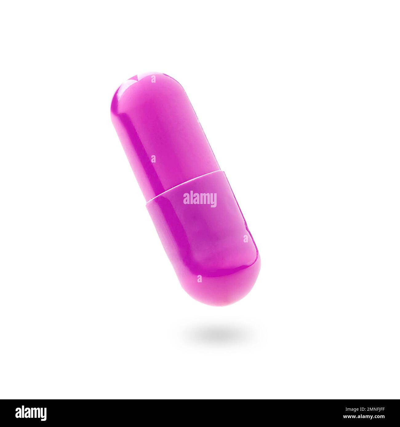 Pink gel capsule. Pink medicine capsule on white background. food supplement, pharmacy concept. Stock Photo