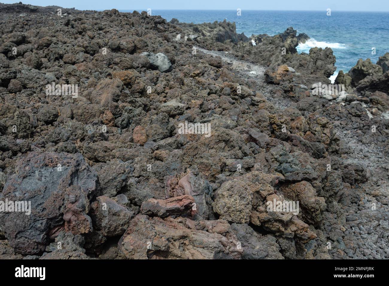 Volcanic rock cliffs eroded by the sea in Lanzarote Stock Photo