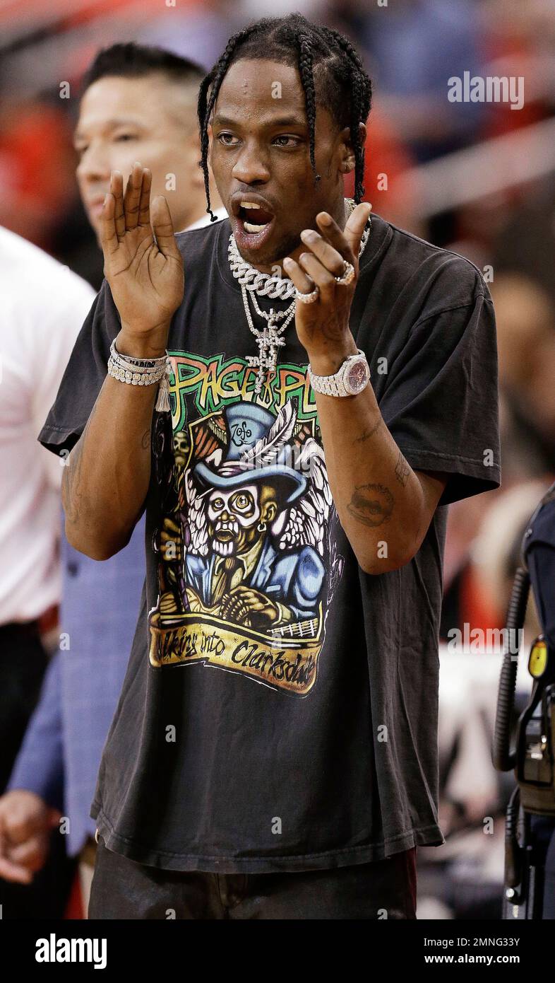 Hip hop performer Travis Scott cheers on the Houston Rockets before Game 2  of the team's first-round NBA basketball playoff series against the  Minnesota Timberwolves, Wednesday, April 18, 2018, in Houston. (AP