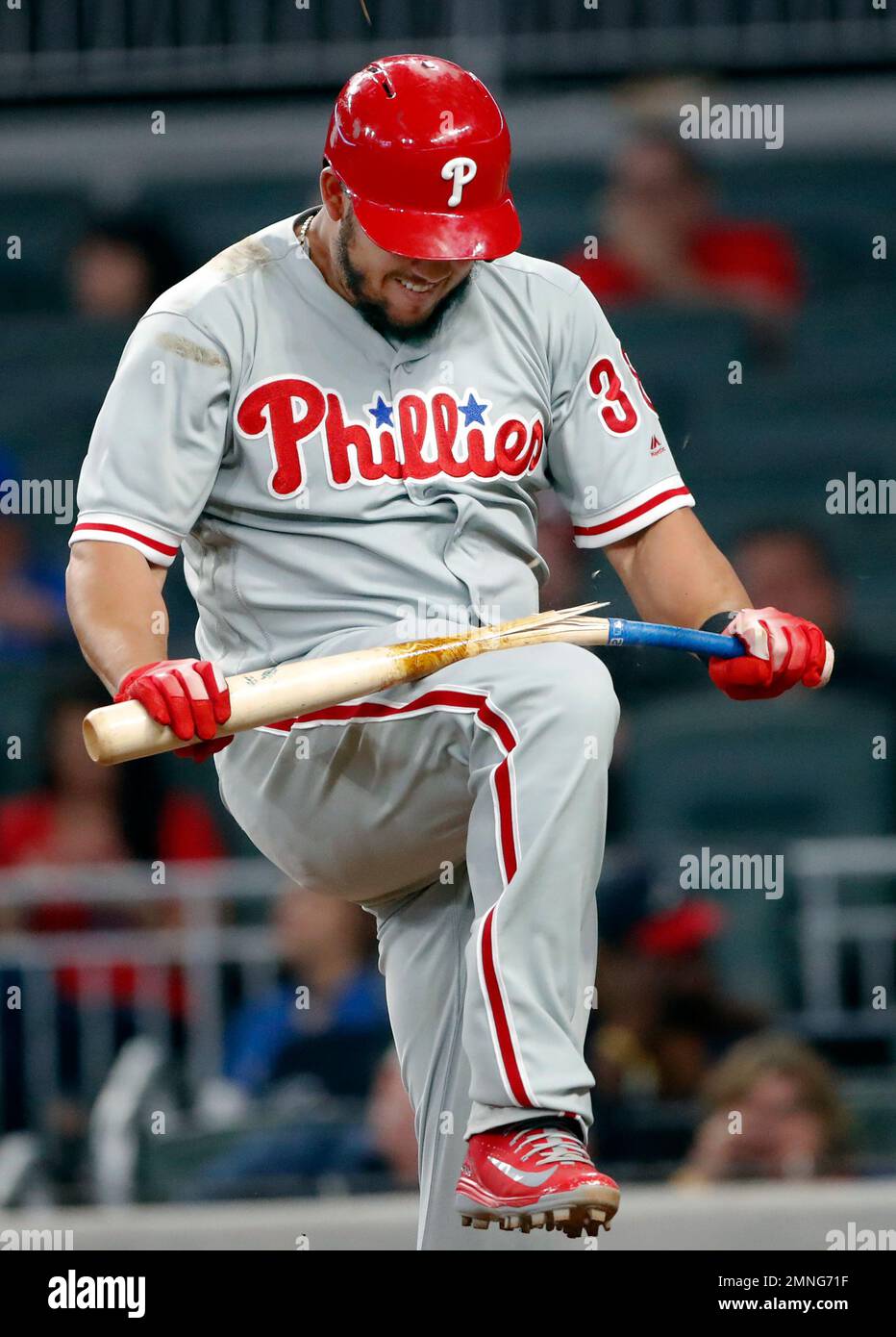 Baseball Players Breaking Bats