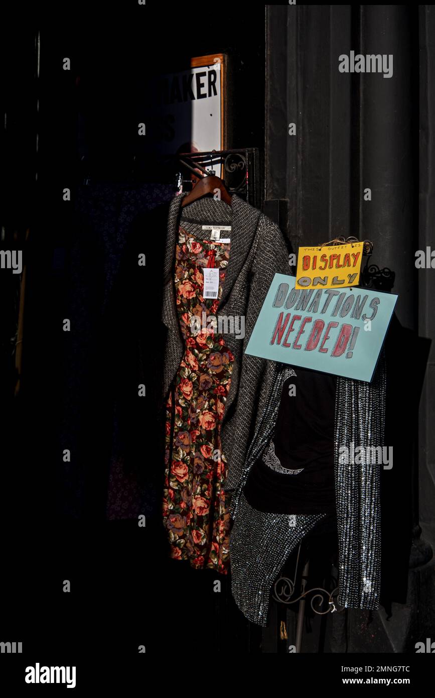 'Donations Needed' sign on a mannequin outside a Shelter charity shop on Forrest Road, Edinburgh, Scotland, UK. Stock Photo