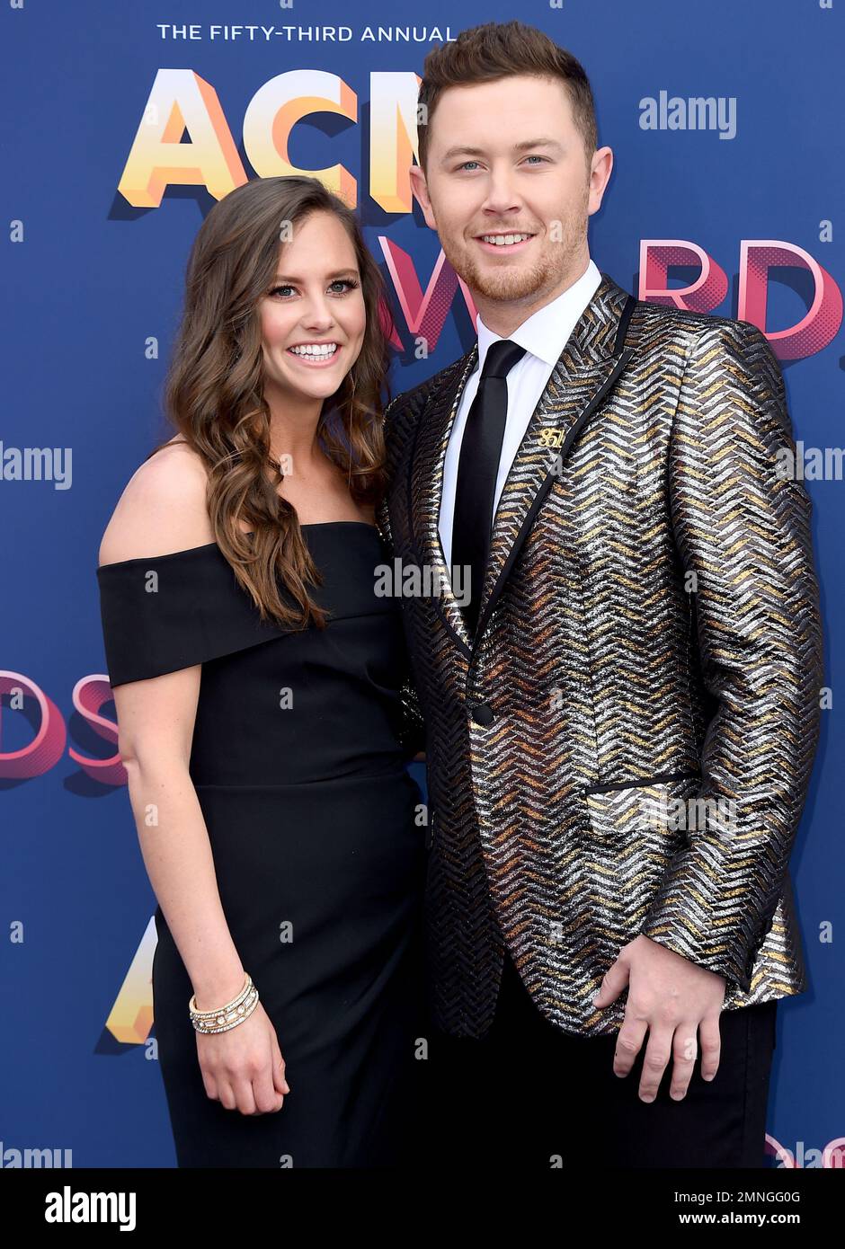 Gabi Dugal, left, and Scotty McCreery arrive at the 53rd annual Academy