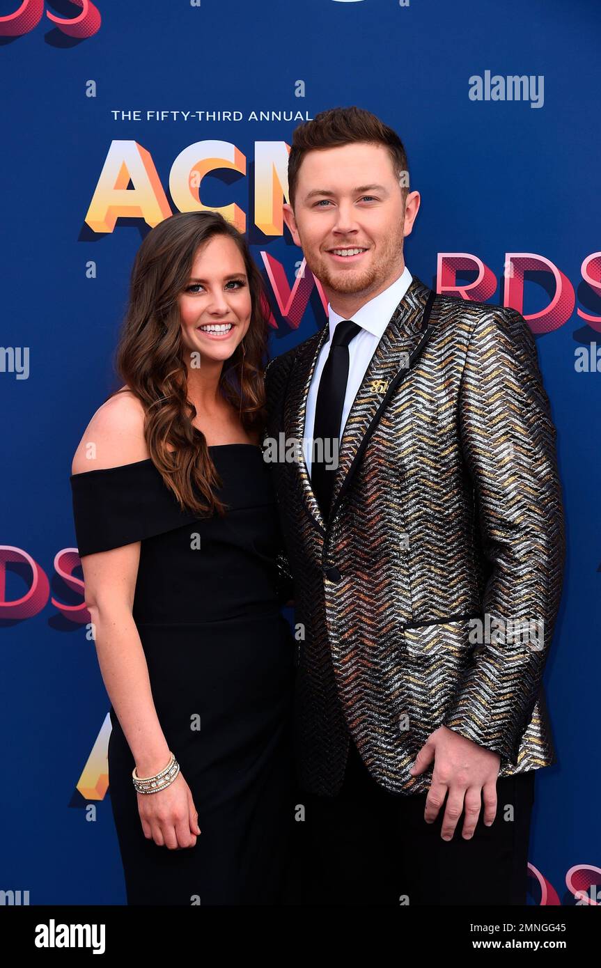 Gabi Dugal, left, and Scotty McCreery arrive at the 53rd annual Academy