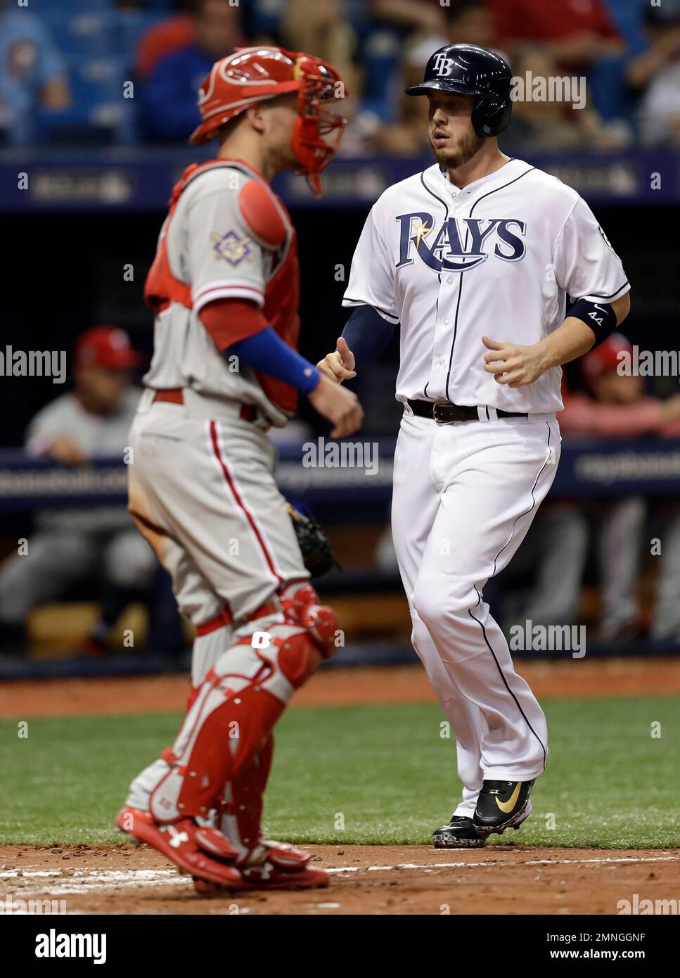 Tampa Bay Rays' C.J. Cron, right, scores in front of Philadelphia