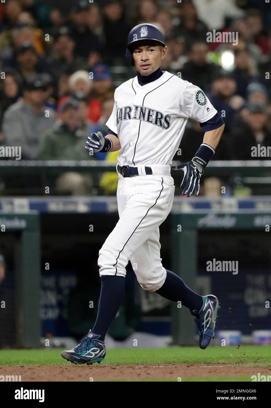 Seattle Mariners' Ichiro Suzuki scores against the Oakland Athletics