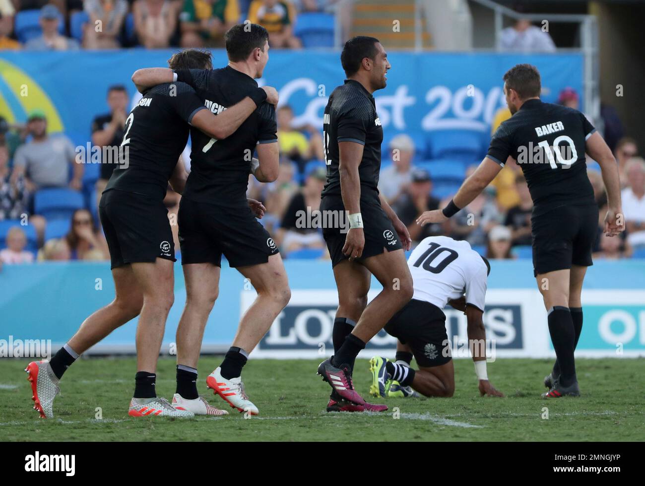 New Zealand players celebrate after defeating Fiji in their rugby sevens gold medal match at Robina Stadium during the 2018 Commonwealth Games on the Gold Coast, Australia, Sunday, April 15, 2018