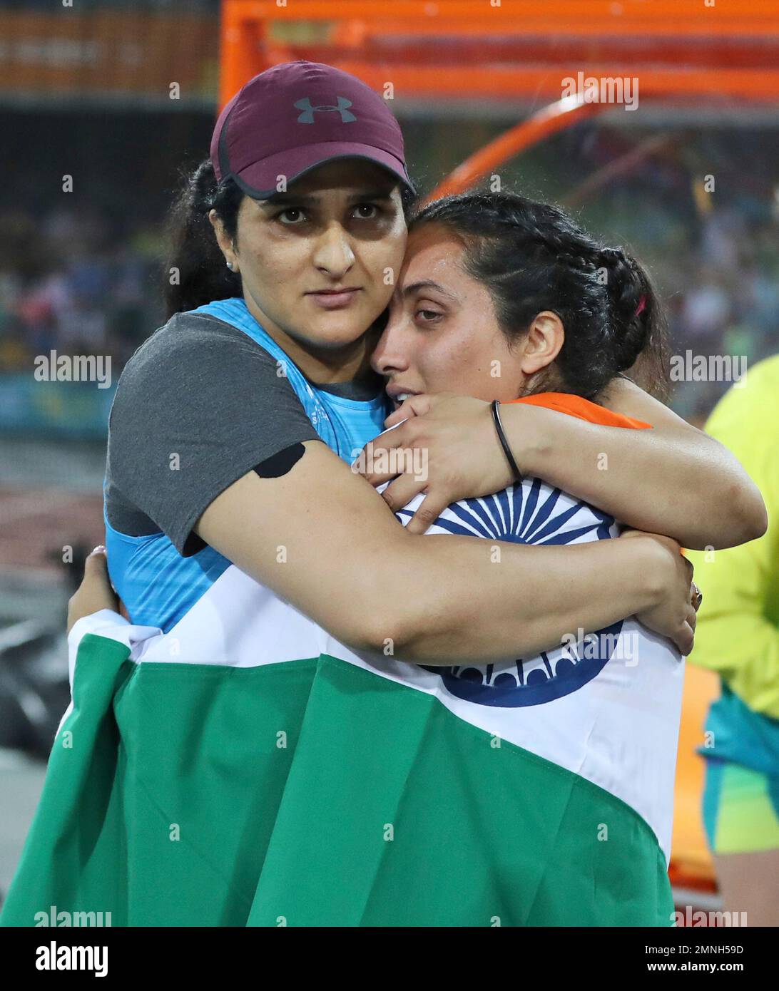 Silver medalist for the women's discus throw India's Seema Punia, left
