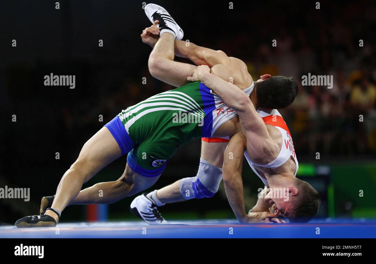 Pakistan's Muhammad Bilal, left, wrestles with England's Ramm to
