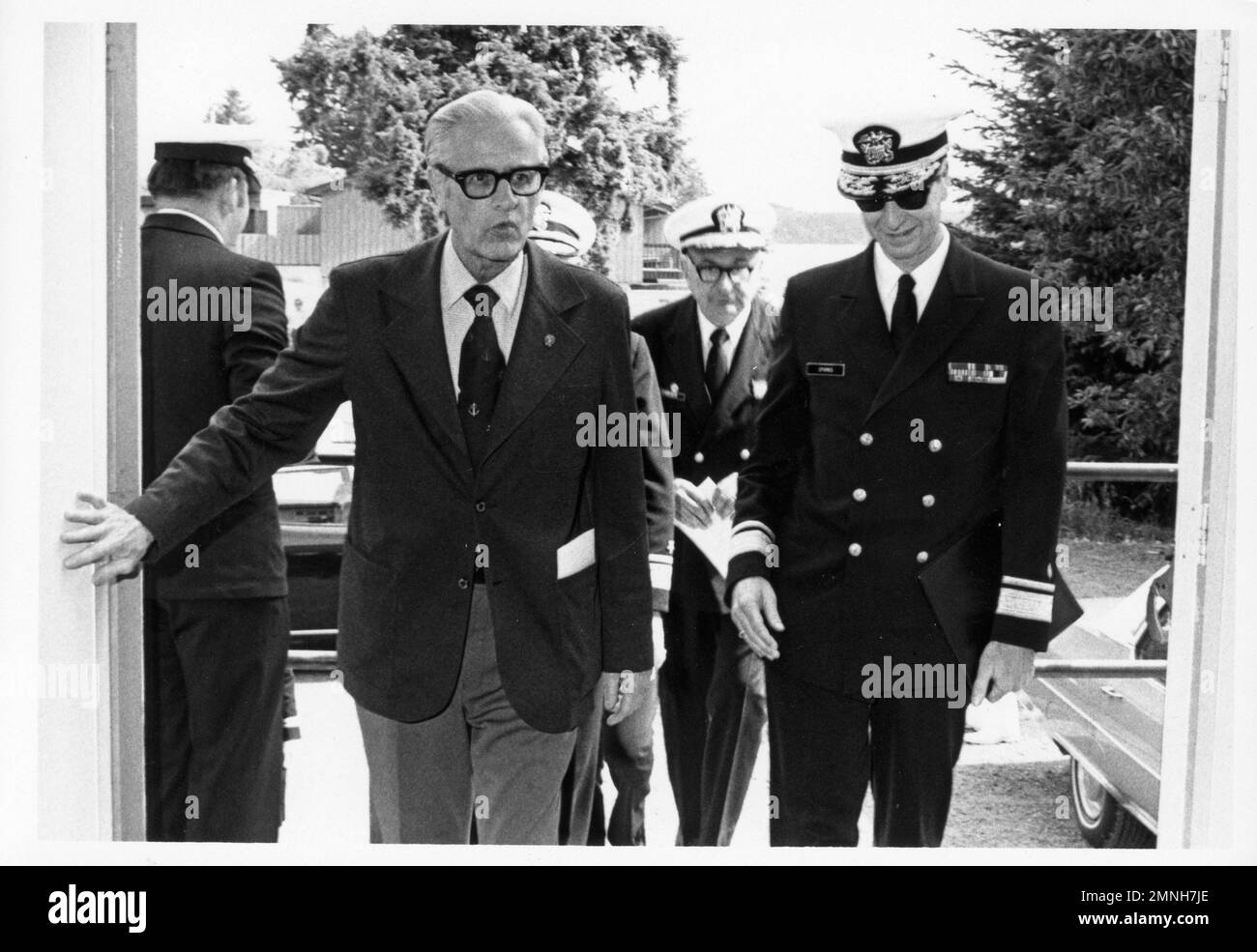 Congressman Floyd V. Hicks arriving for ground-breaking ceremony, NRMC Bremerton, July 7, 1976, accompanied by RADM H.A. Sparks, MC, USN and CAPT H.P. Pariser, MC, USN. Stock Photo