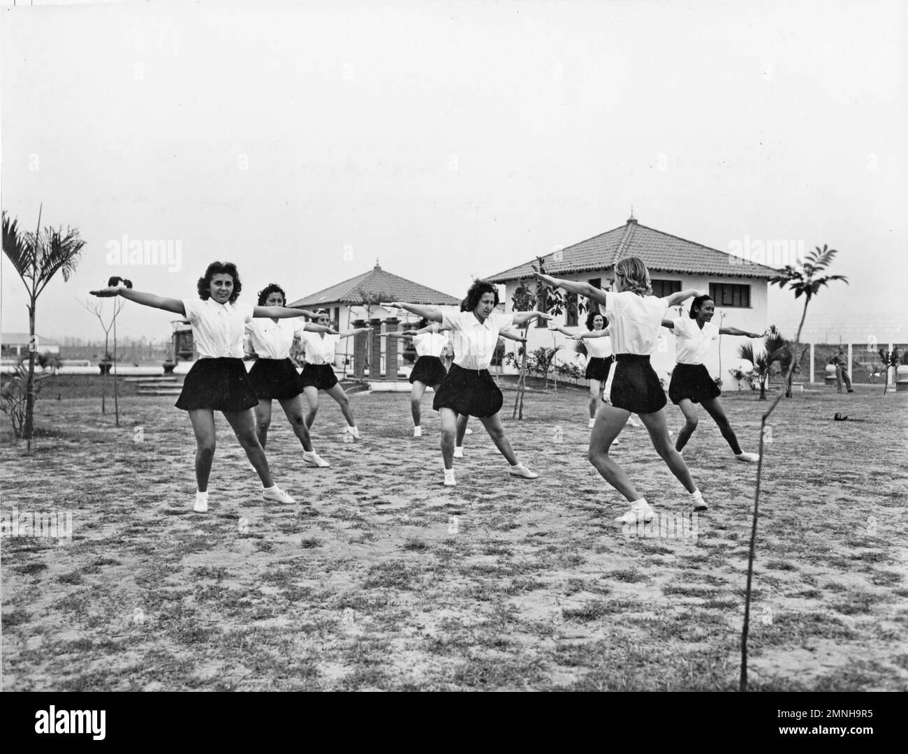 U.S. Navy Nurse putting the Brazilian Air Evacuation Nurses through calisthenics. This course was inaugurated by two Navy Nurses in September ca. 1944 Stock Photo