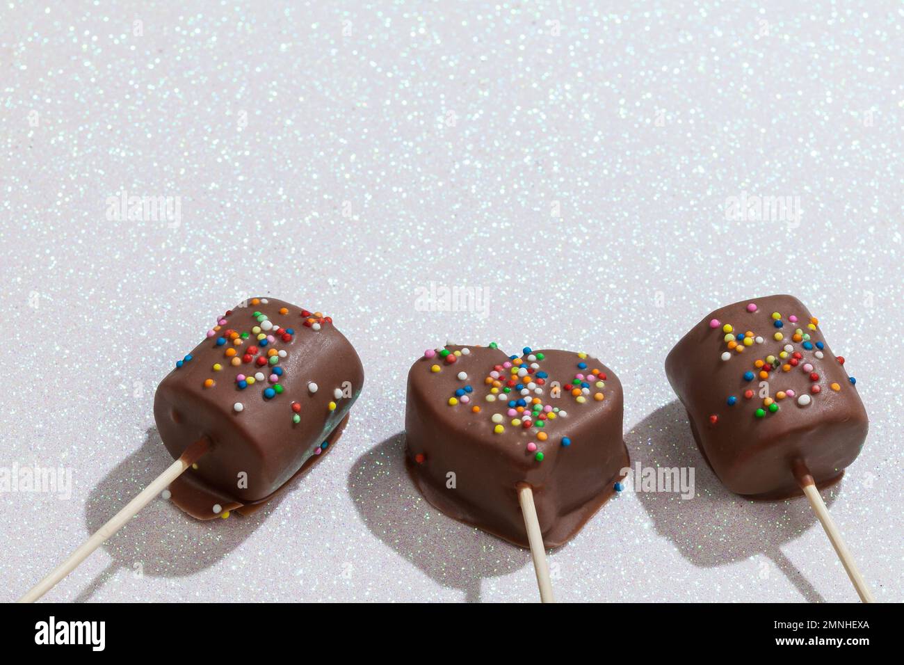 Marshmallows Covered With Chocolate And With Mini Colored Dragees. Stock Photo