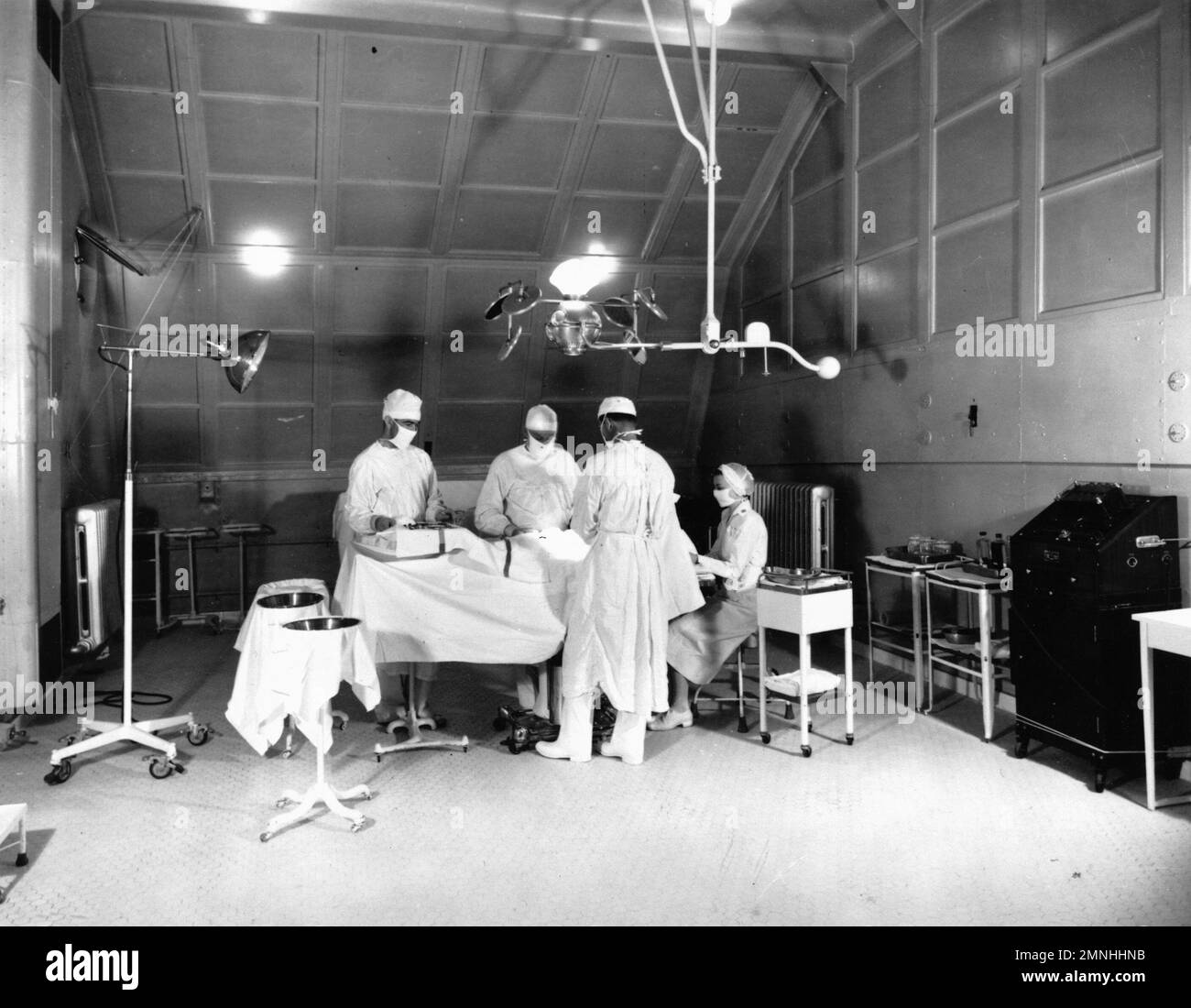 Doctors perform surgery in an operating room aboard hospital ship
