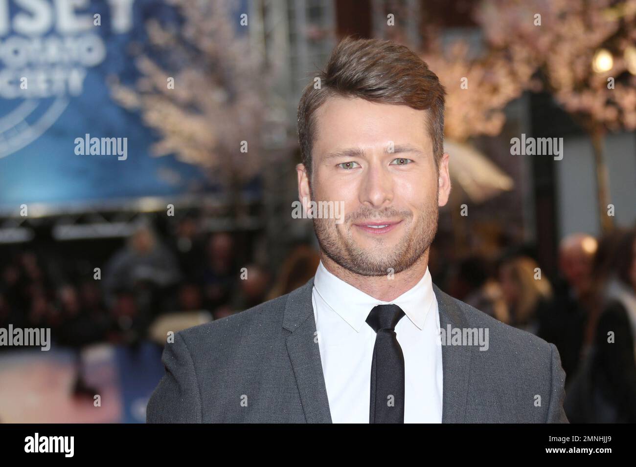 Actor Glen Powell poses for photographers upon arrival at the premiere