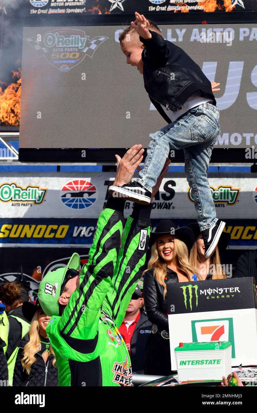 Kyle Busch celebrates with his son Brexton Locke in victory lane after