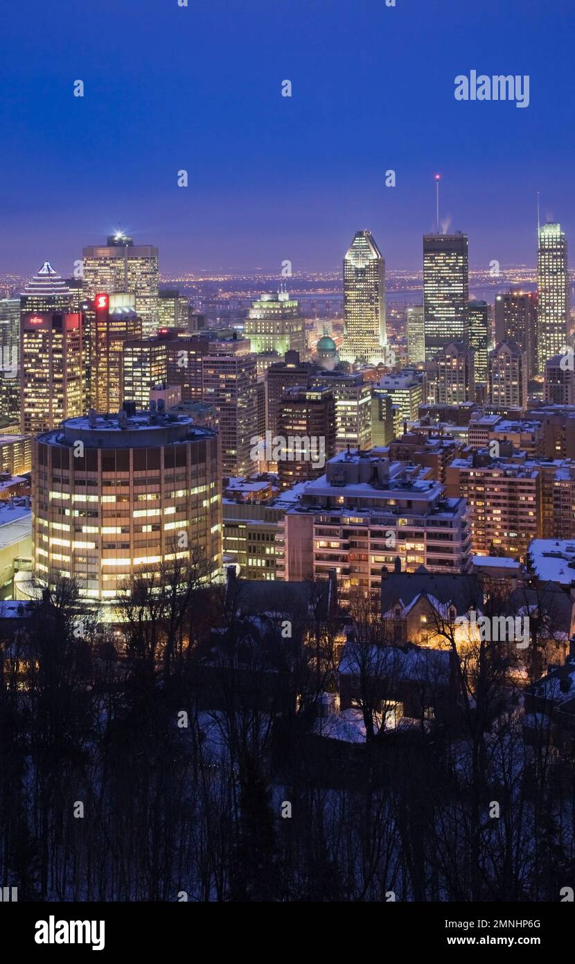 Montreal skyline illuminated at dusk in winter from Mount Royal lookout, Quebec, Canada. Stock Photo
