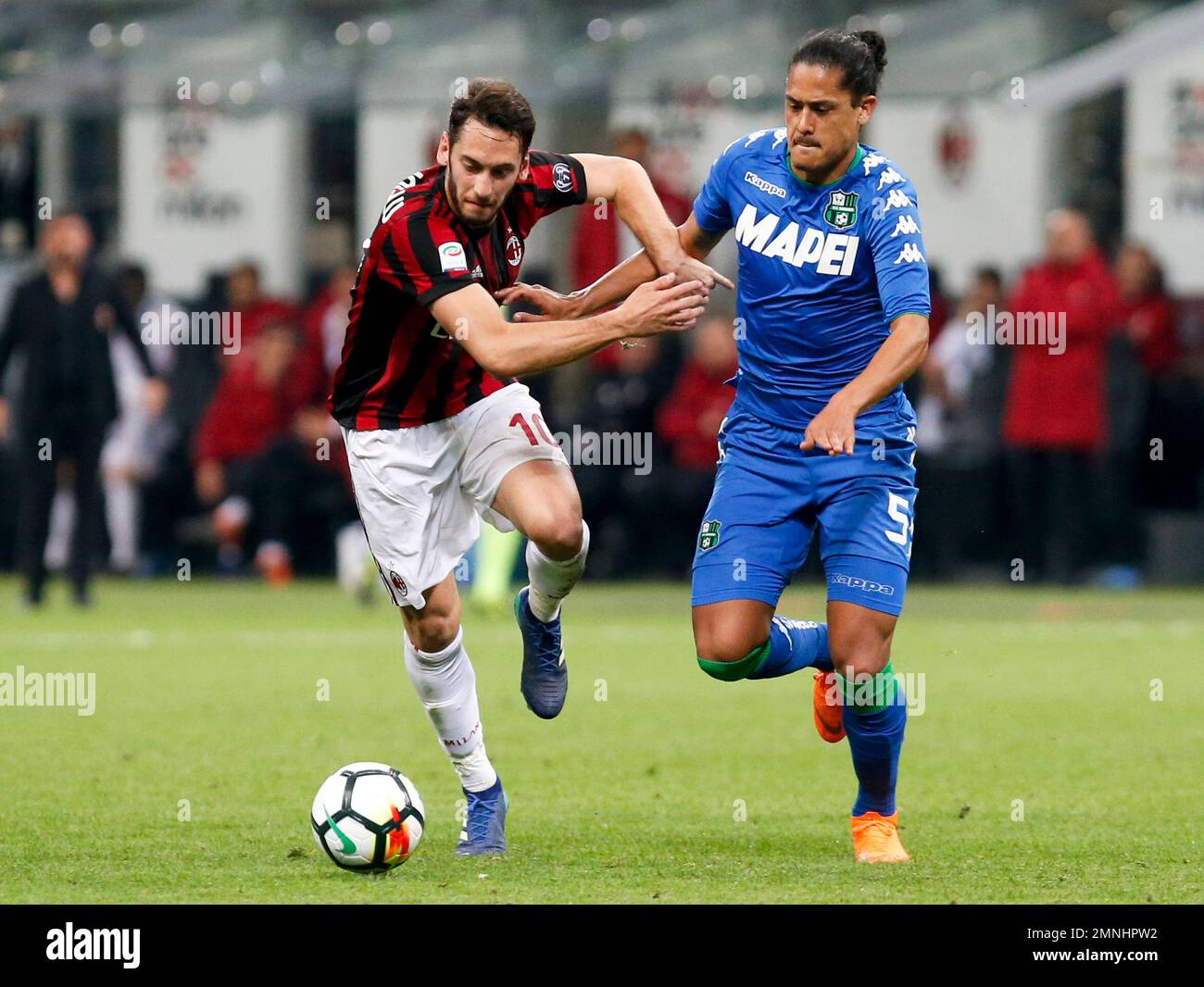 AC Milan's Hakan Calhanoglu, left, and Roma's Chris Smalling fight for the  ball during a Serie A soccer match between Roma and AC Milan, at Rome's  Olympic Stadium, Sunday, Oct. 27, 2019. (