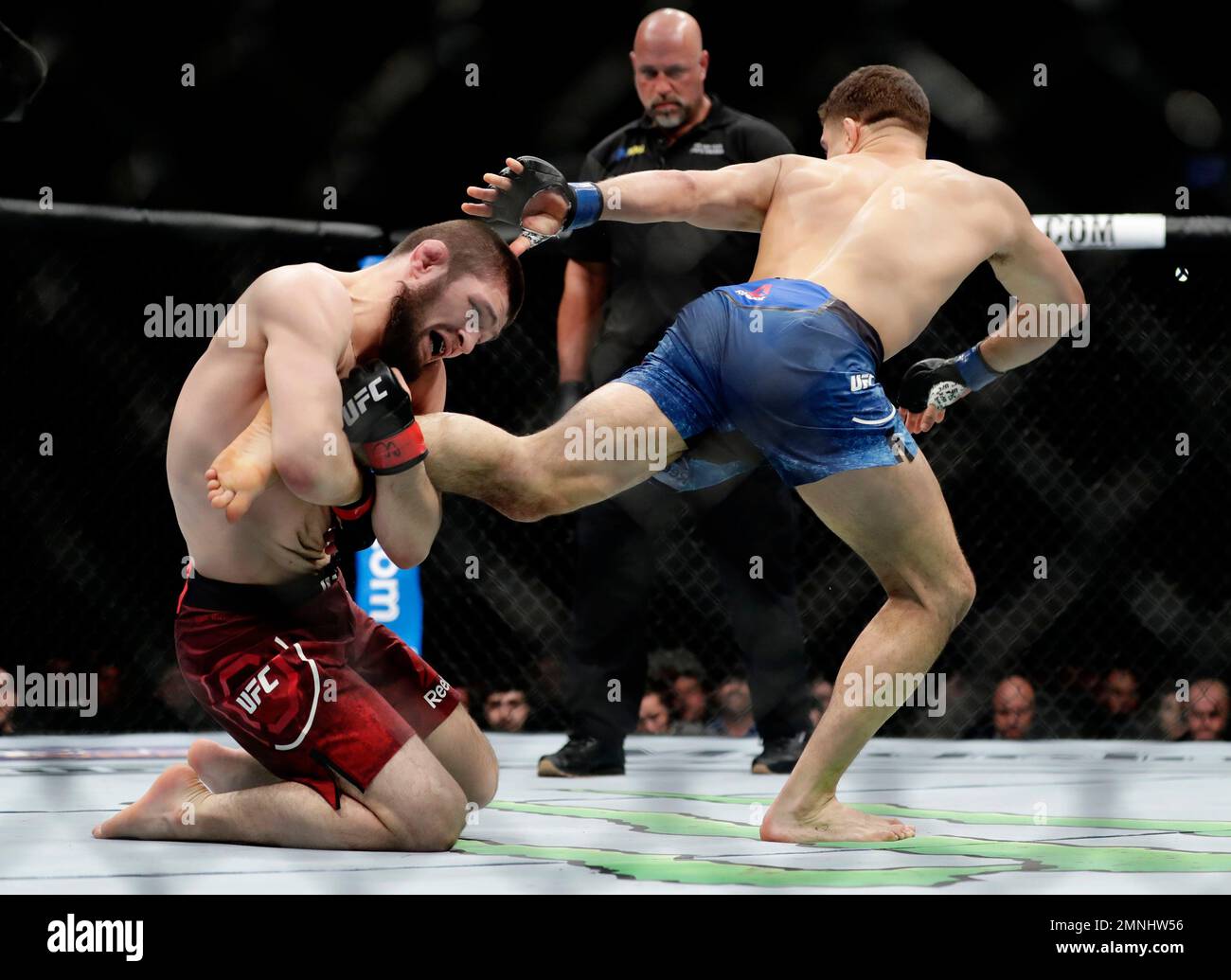 Russia's Khabib Nurmagomedov grabs the leg of Al Iaquinta during a ...