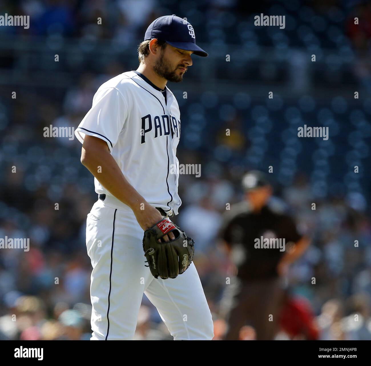 San Diego Padres relief pitcher Brad Hand reacts to walking
