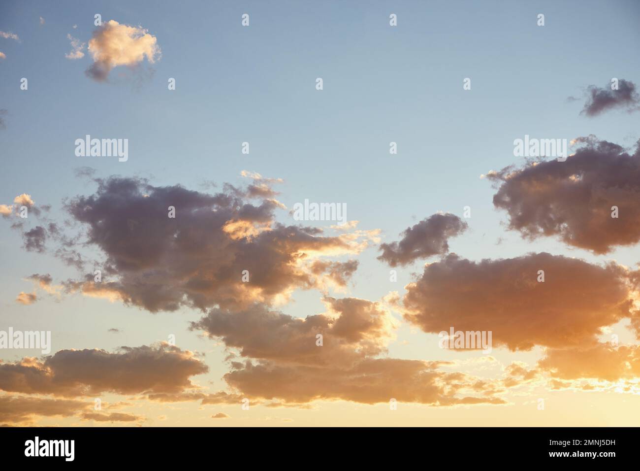 Clouds on blue sky at sunset Stock Photo
