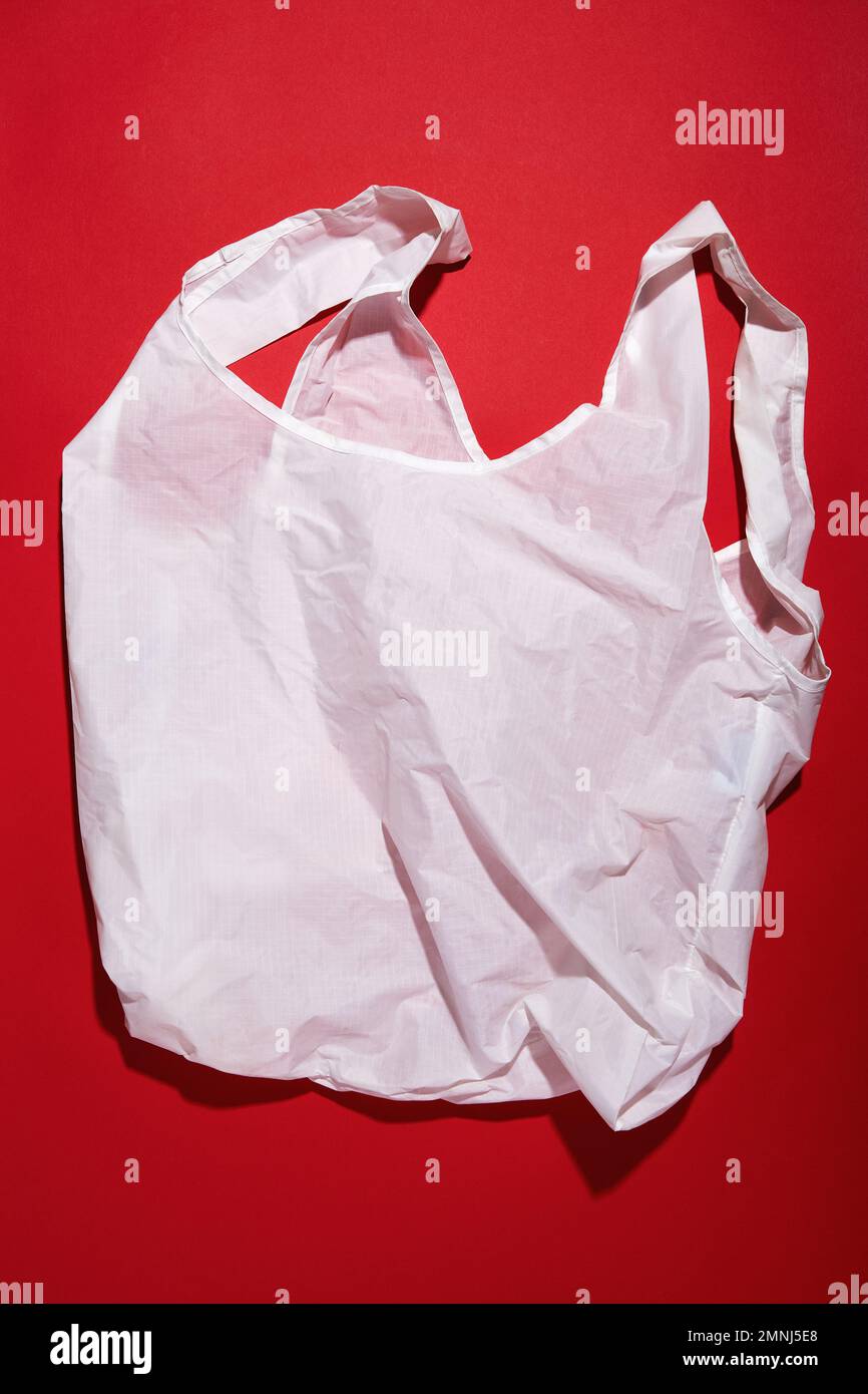 Reusable shopping bag against red background Stock Photo