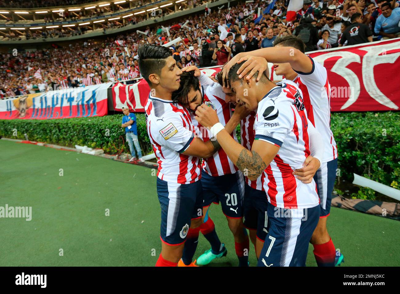 In this April 4, 2018 photo, Isaac Brizuela of Mexico's Chivas is  surrounded by teammates after he scored the game's only goal against the New  York Red Bulls at a CONCACAF Champions