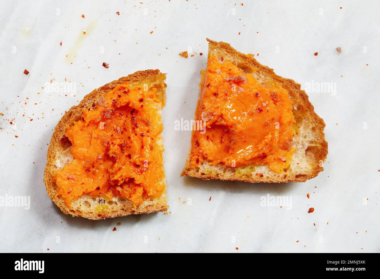 Slice of bread with mashed sweet potato Stock Photo