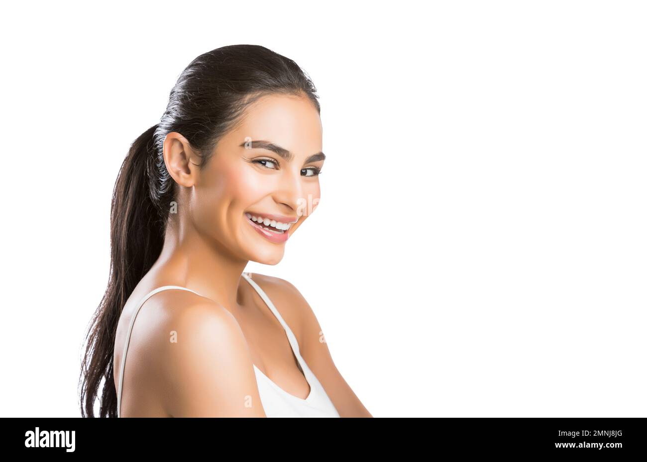 Portrait of smiling young woman looking at camera Stock Photo