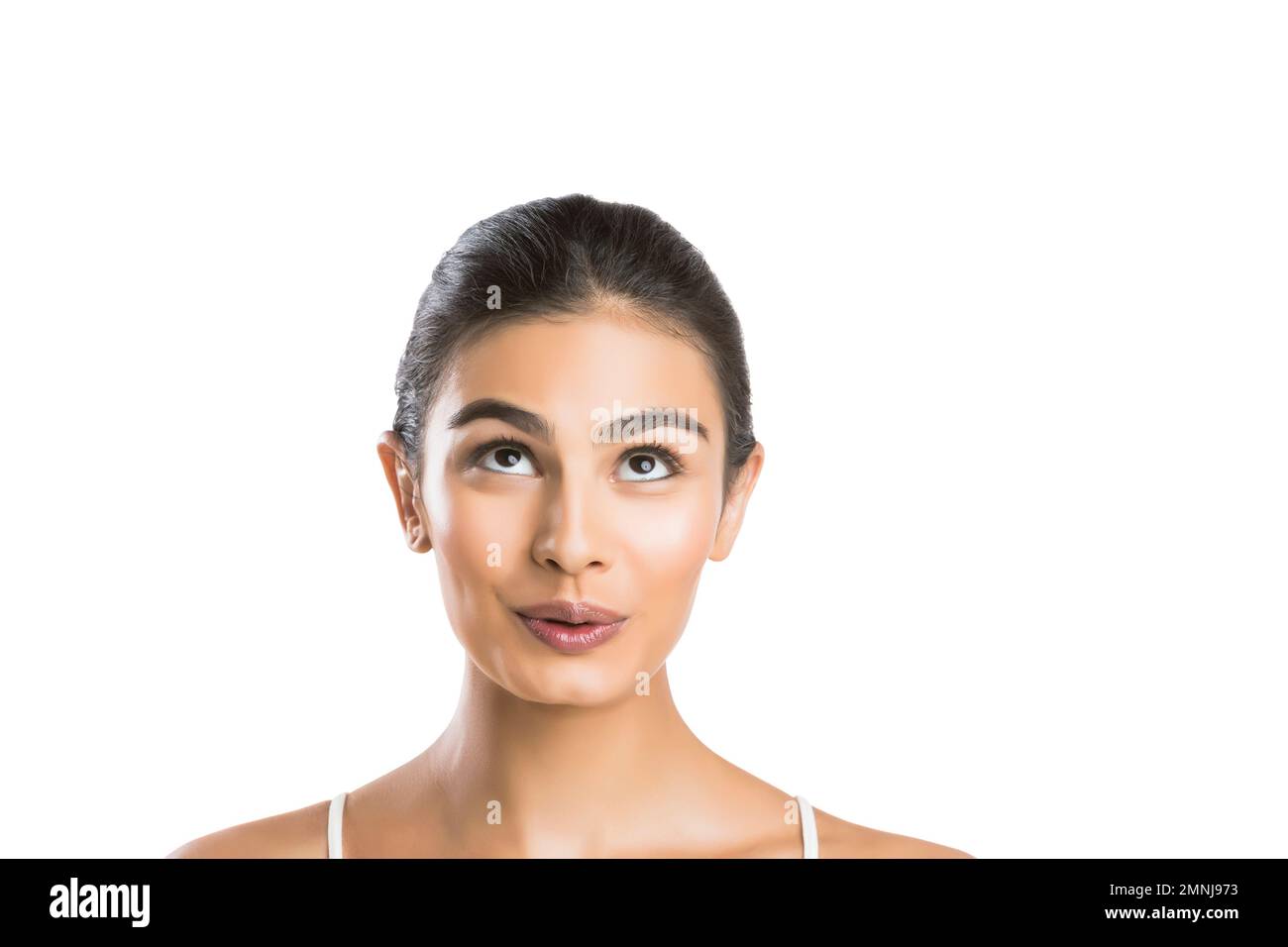 Portrait of young woman looking up Stock Photo
