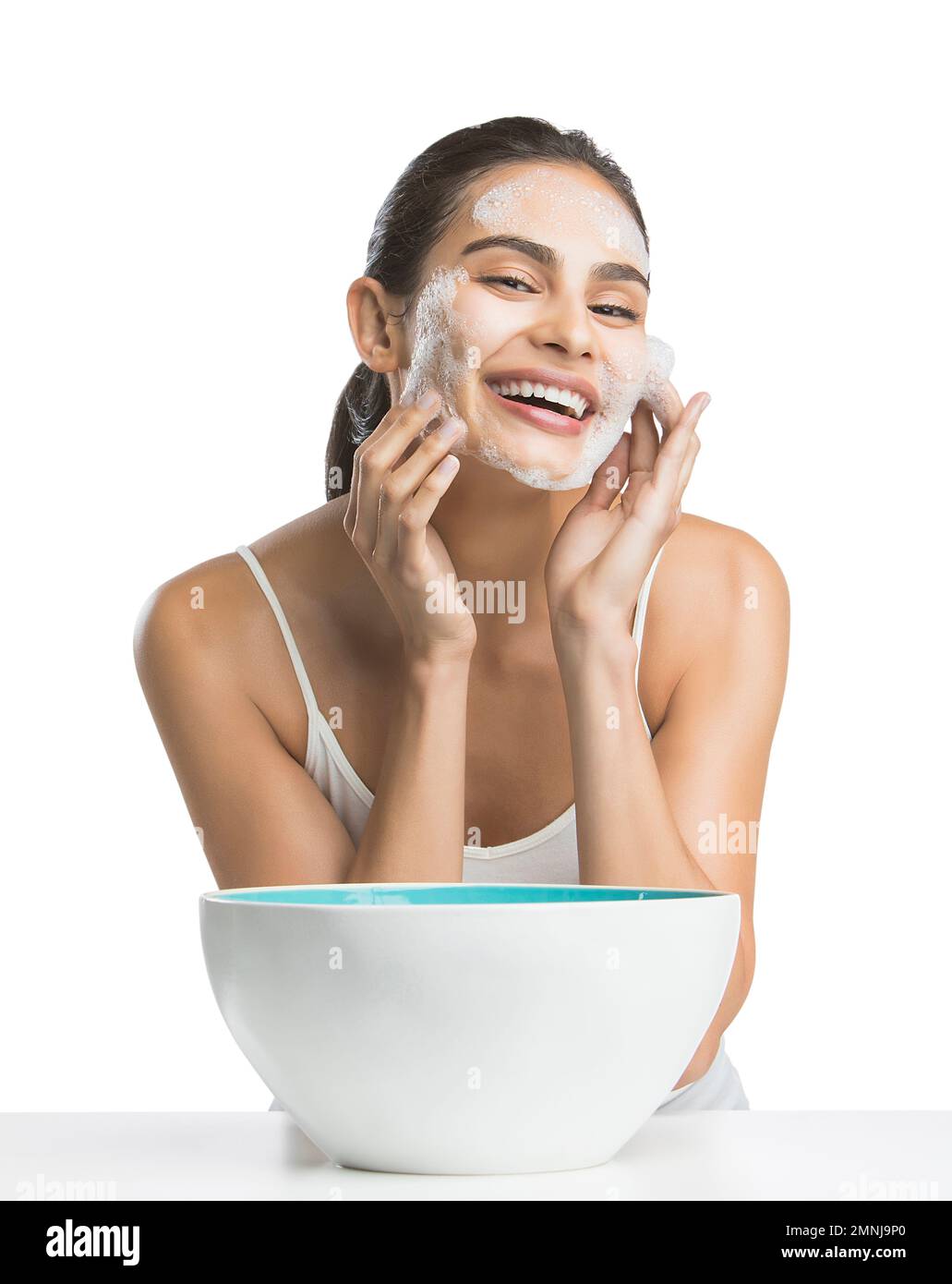 Woman washing face smiling camera hi-res stock photography and images ...