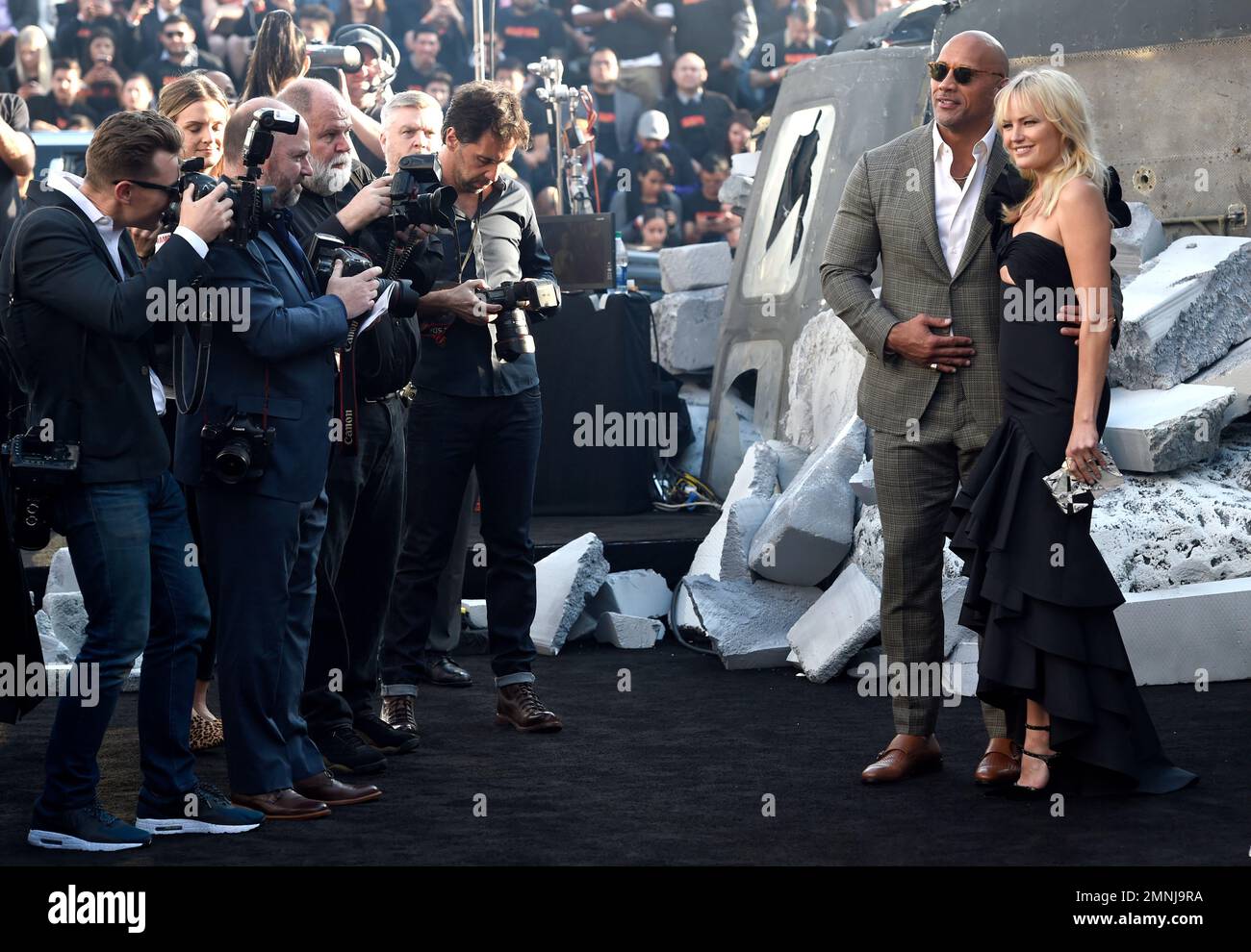 Dwayne Johnson, left, and Malin Akerman arrive at the world premiere of