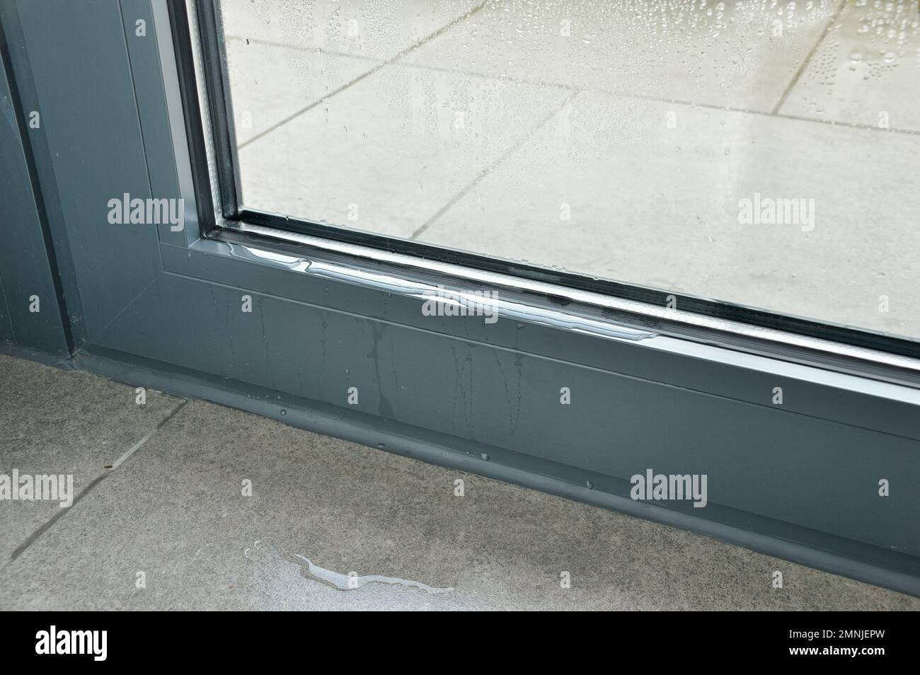 Frozen window frame condensation inside, close up. Ice builtup on black  metal window frame due to excessive moisture or vapour in the house and  freezi Stock Photo - Alamy