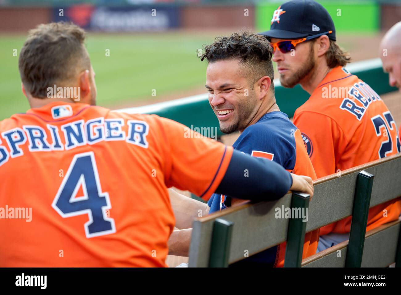 Jose Altuve of the Houston Astros jokes with teammates in the