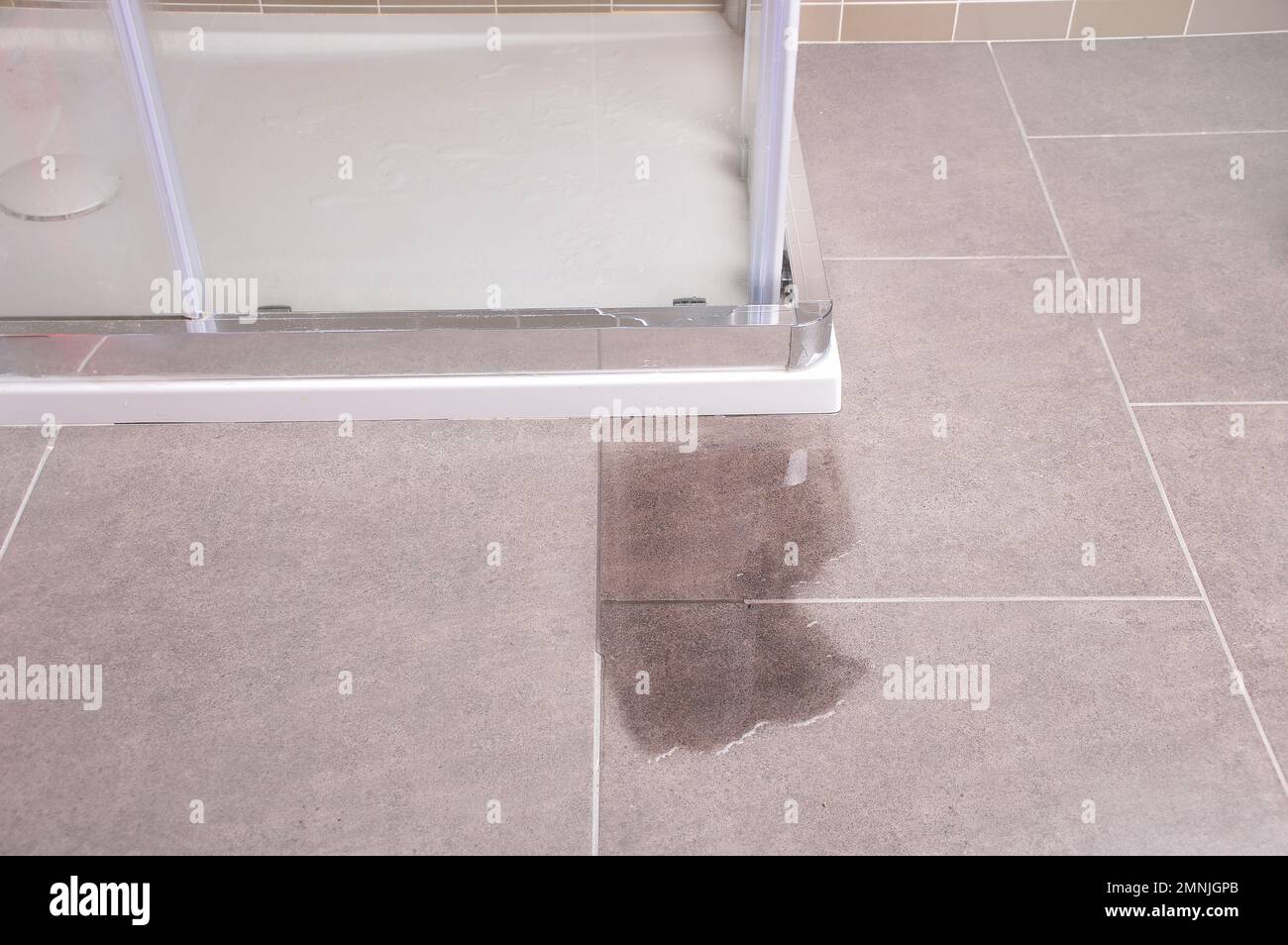Leakage of water from a shower cabin with glass wall that is damaged Stock Photo Alamy