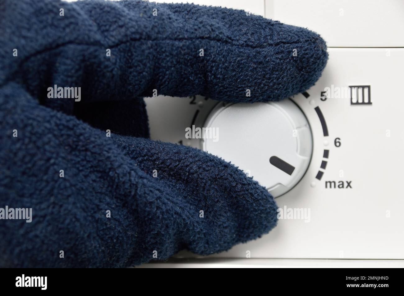 hand rotate temperature adjuster of water heater.High temp Stock Photo