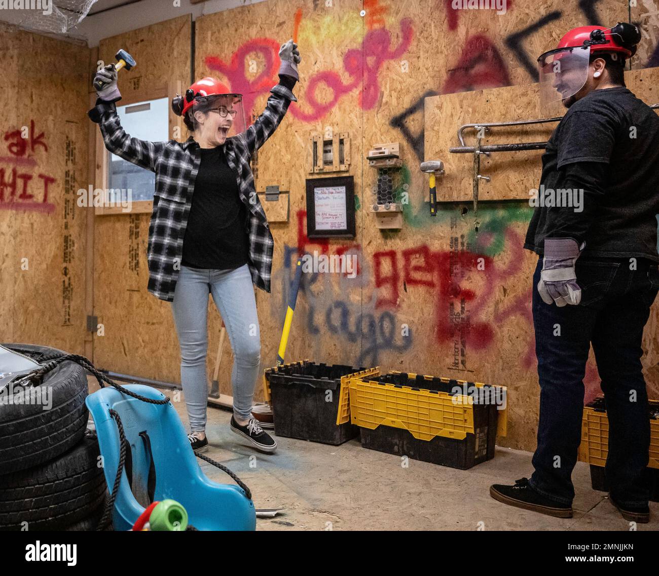 Albuquerque, New Mexico, USA. 28th Jan, 2023. Roberto E. Rosales.ABQ Rage Room is New Mexico's first Rage Room, a place where someone can visit who's looking to break things and let some frustrations out. They offer experiences for both groups and individuals. Pictured is Kiara Corona(Cq), left, exploding in joy after breaking items with her husband Juan Corona(Cq) Saturday afternoon. Albuquerque, New Mexico/Roberto E. Rosales/Albuquerque Journal (Credit Image: © Roberto E. Rosales/Albuquerque Journal via ZUMA Press Wire) EDITORIAL USAGE ONLY! Not for Commercial USAGE! Stock Photo