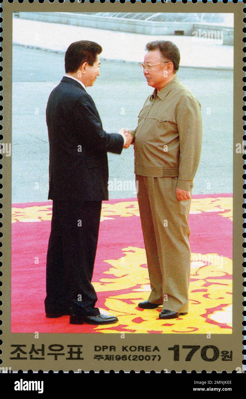 North Korean postage stamp from 2007 depicting the historic handshake between Kim Jong-il and Roh Moo-hyun during the Inter-Korean Summit. Stock Photo