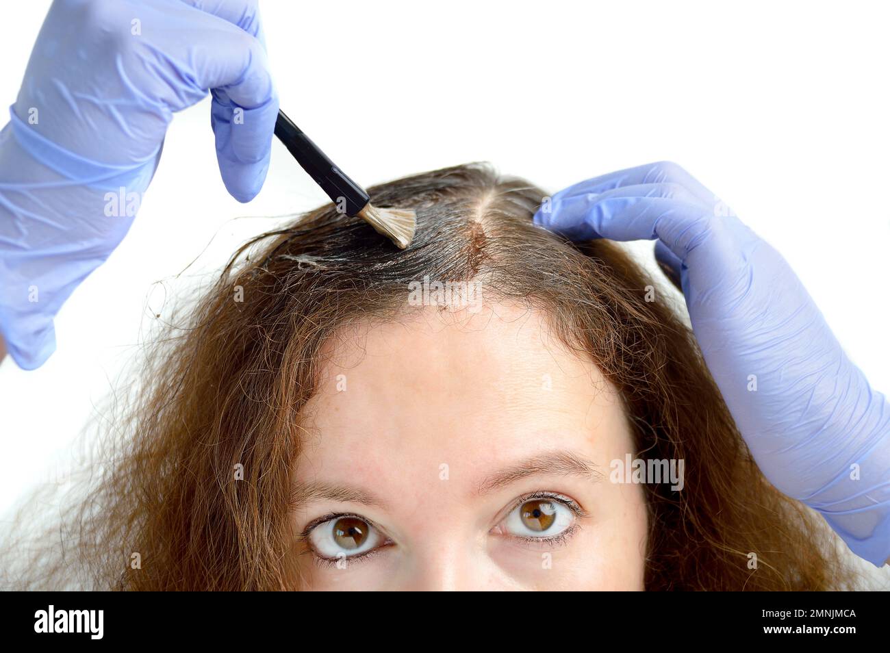 woman dying her hair with white background Stock Photo Alamy