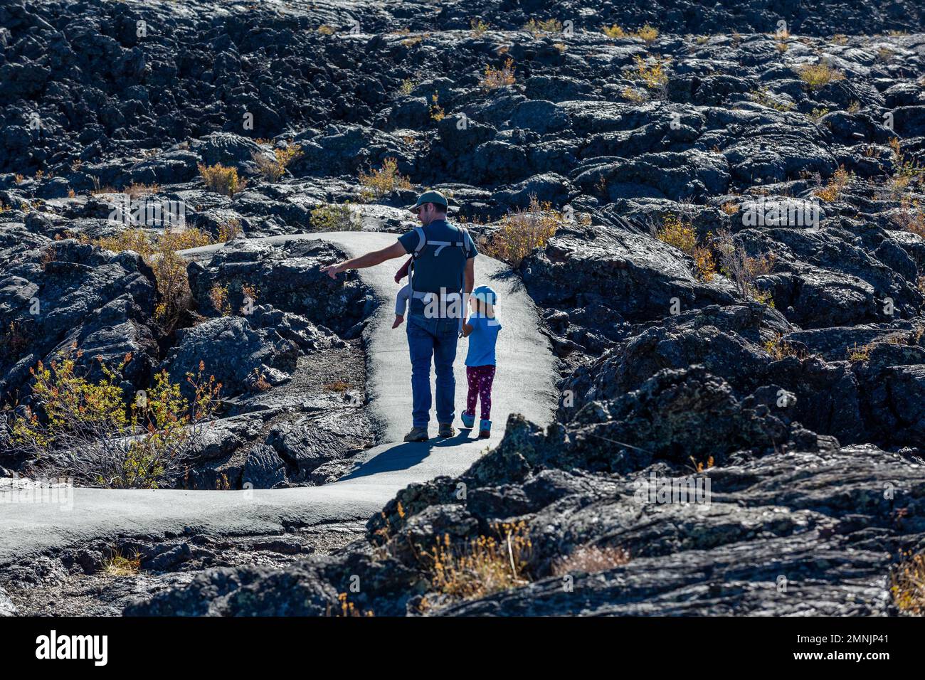 USA, Idaho, Arco, Father showing daughter (6-7) lava field Stock Photo