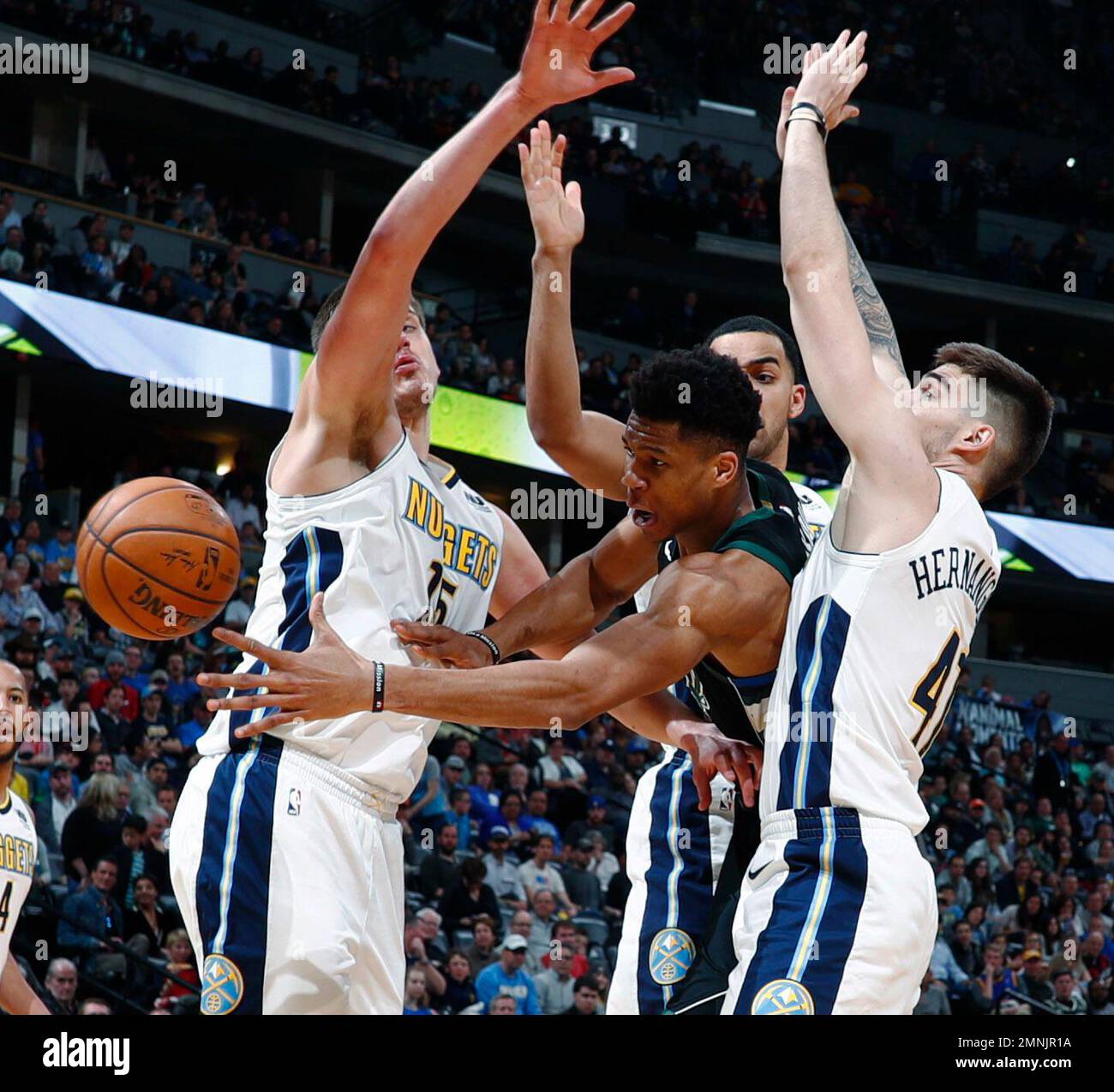Milwaukee Bucks forward Giannis Antetokounmpo passes the ball as Denver